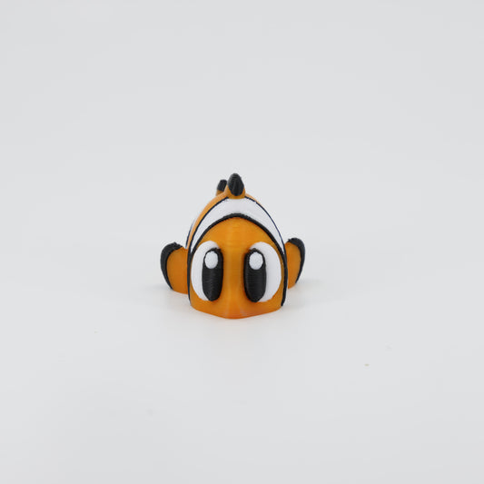 3D printed Clownfish Wiggle Bud fidget toy shown from the front. Highlights the cute face and articulated pectoral fins.