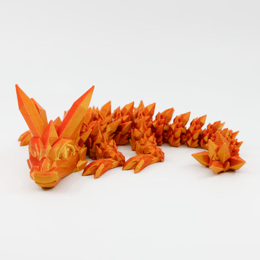 Side profile of baby crystal dragon with articulated body and curled tail