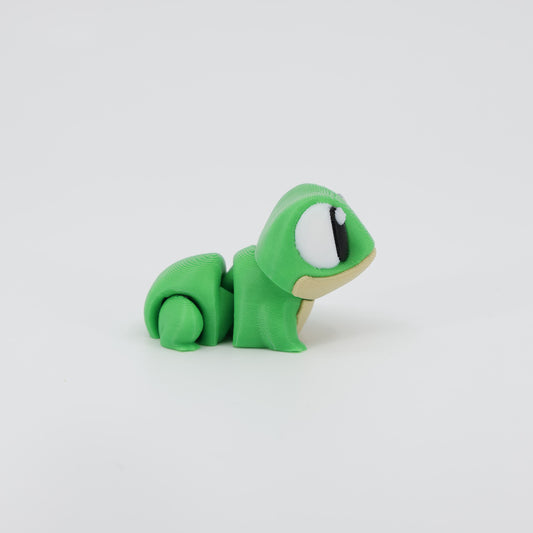 Side profile of the Australian made articulated frog fidget, showing the crouching posture and flexi body movement.