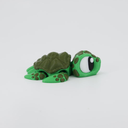 Side profile of the Australian made articulated turtle fidget, showing the streamlined shell and flexi swimming movement.