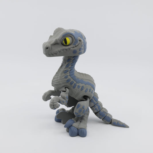 Side view of articulated Velociraptor fidget – sensory dinosaur figure