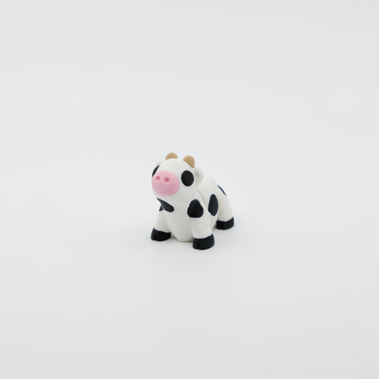 Front view of articulated mini cow sensory fidget with 3D printed face, horns, and detailed features