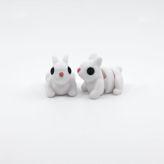 Two articulated bunny fidgets displayed together, showcasing sensory-friendly design and adorable detail