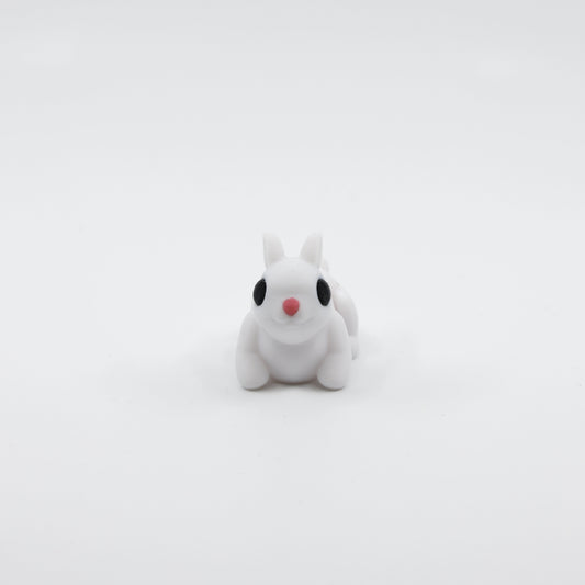 Front view of articulated mini bunny sensory fidget with cute facial features