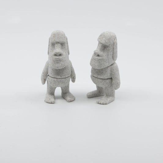 Two articulated mini Moai fidgets side by side, showcasing sensory-friendly design and intricate details