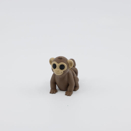 Front view of articulated mini monkey sensory fidget with flexible body segments