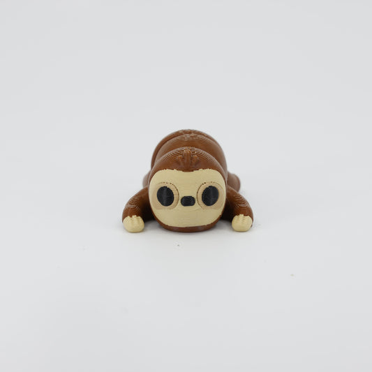 Front view of the Mini Sloth Wiggle Bud fidget toy. Highlights the cute face and articulated back created via 3D printing.