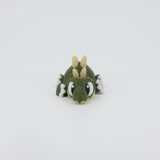Front view of the Mini Stegosaurus Wiggle Bud fidget toy. Highlights the cute face and row of back plates created via 3D printing.