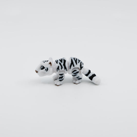 Side view of articulated 3D printed snow tiger fidget toy