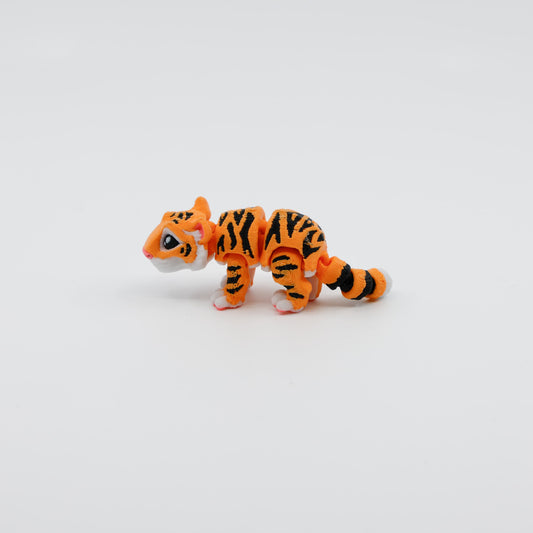 Side view of orange and black tiger fidget toy with movable limbs