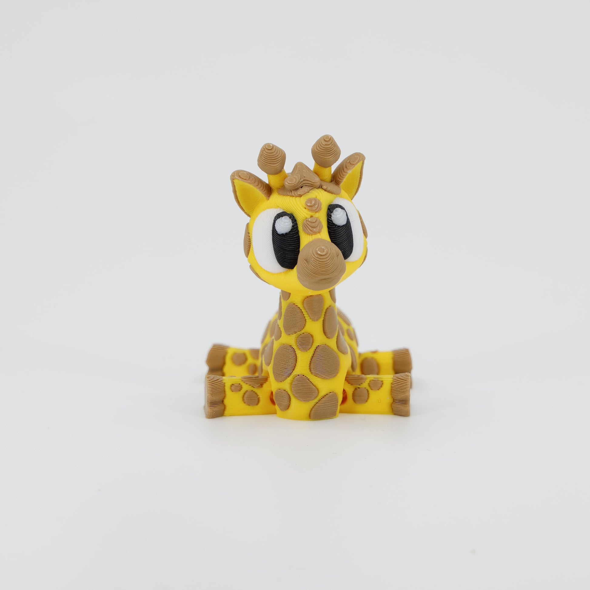 3D printed Giraffe Wiggle Bud flexible toy shown from the front. Emphasizes the articulated long neck and head with ossicones, making it a unique 3D print animal toy.