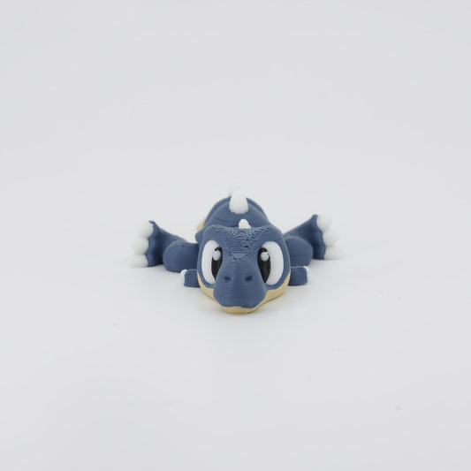 3D printed T-Rex Wiggle Bud flexible toy shown from the front. This popular articulated dinosaur toy features segmented joints and a fun design.