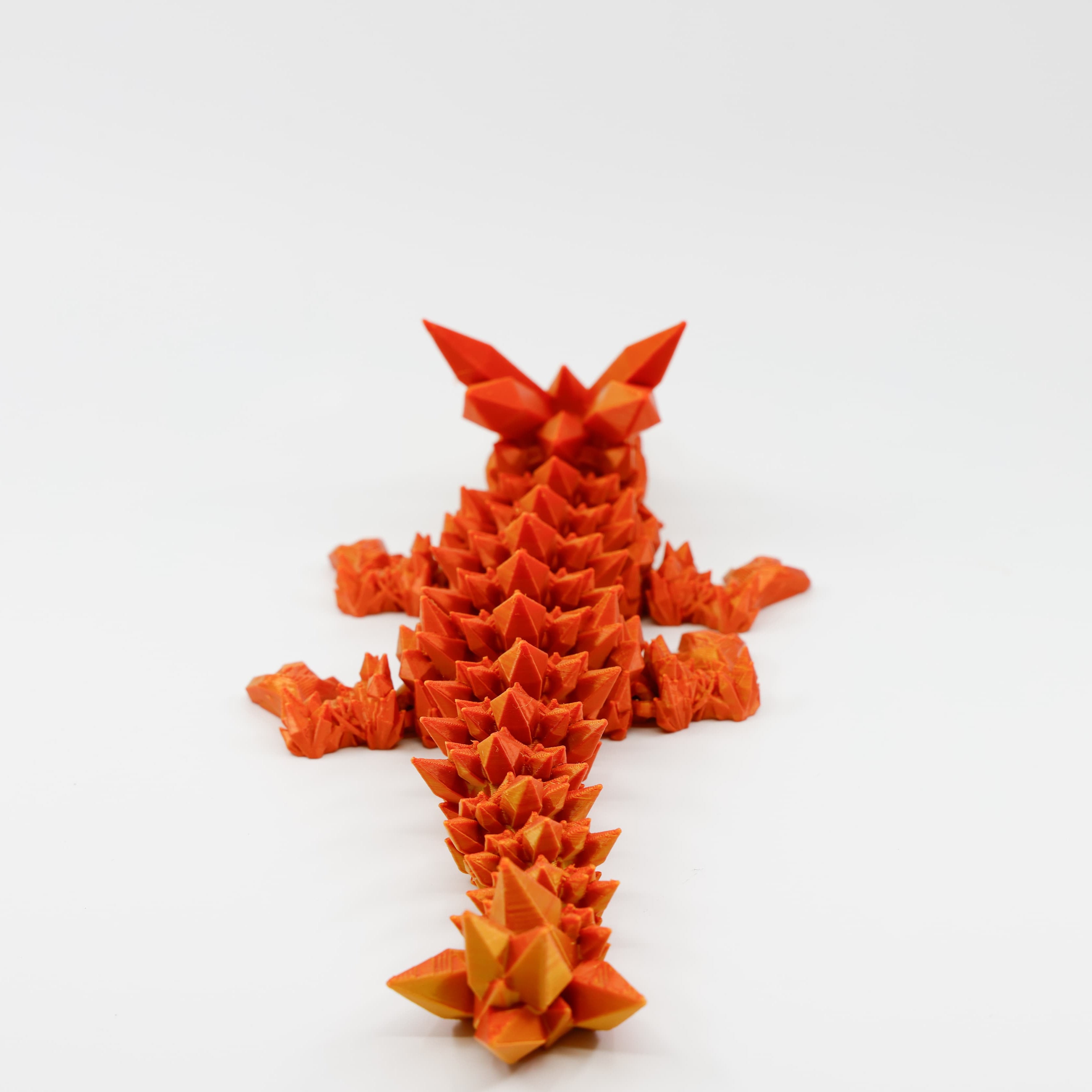 Back view of crystal dragon highlighting shimmering spine and segmented articulation