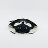 Front view of 3D printed flexible manta ray fidget showing wide wings folded underneath body