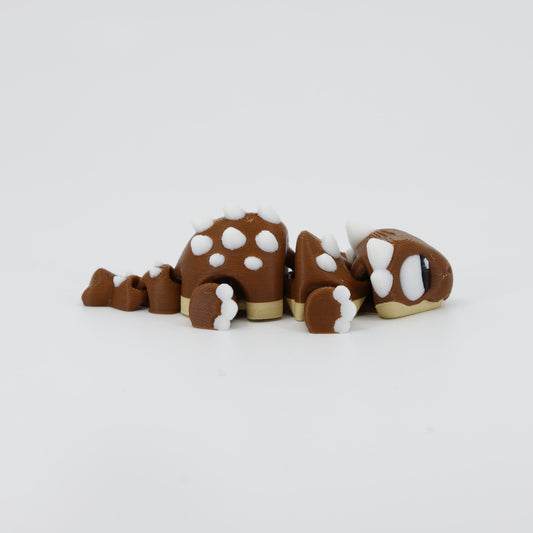 Side profile of the Australian made articulated Ankylosaurus fidget, showing the low profile and flexi armoured body movement.