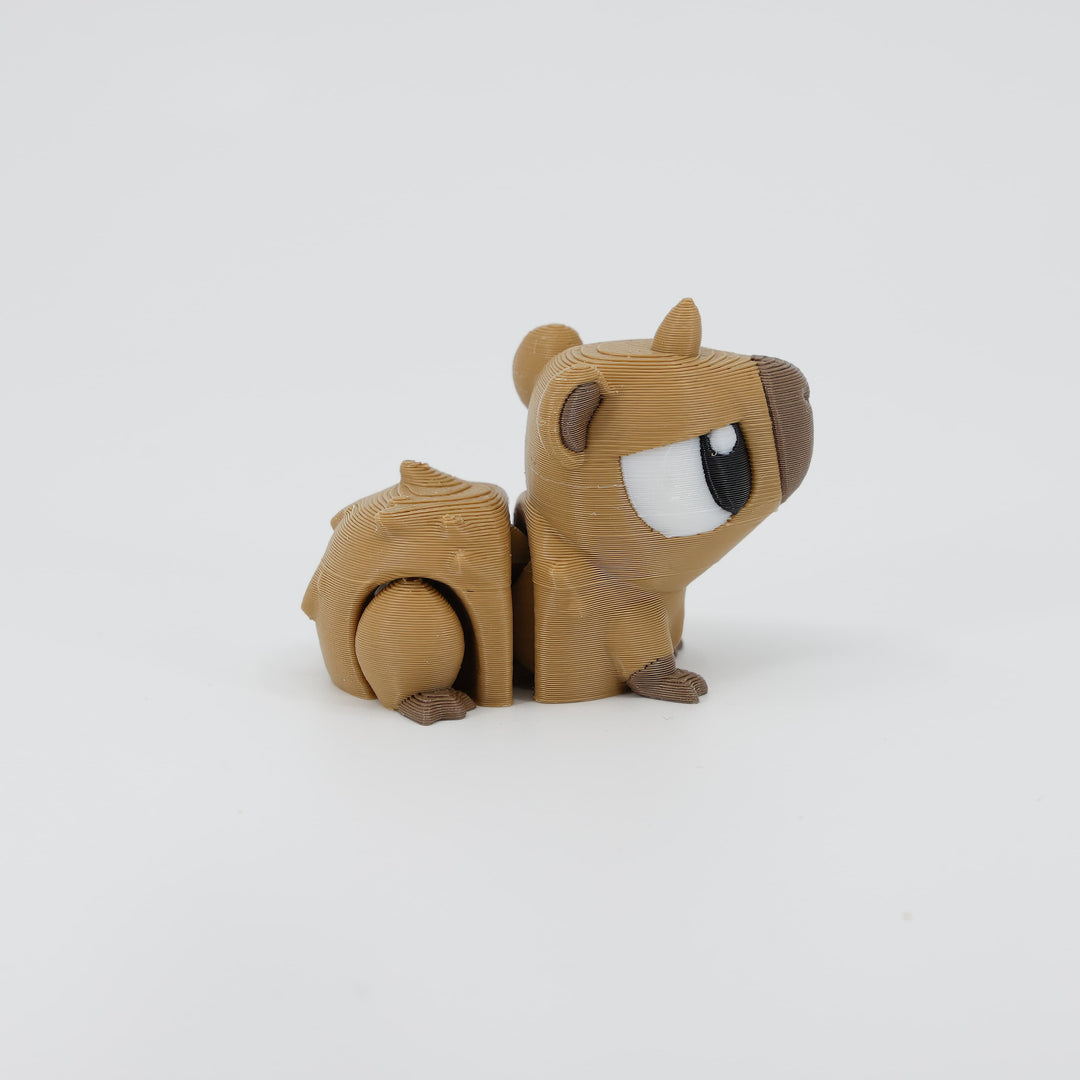 Side profile of the Australian made articulated capybara fidget, showing the relaxed stance and flexi body movement.