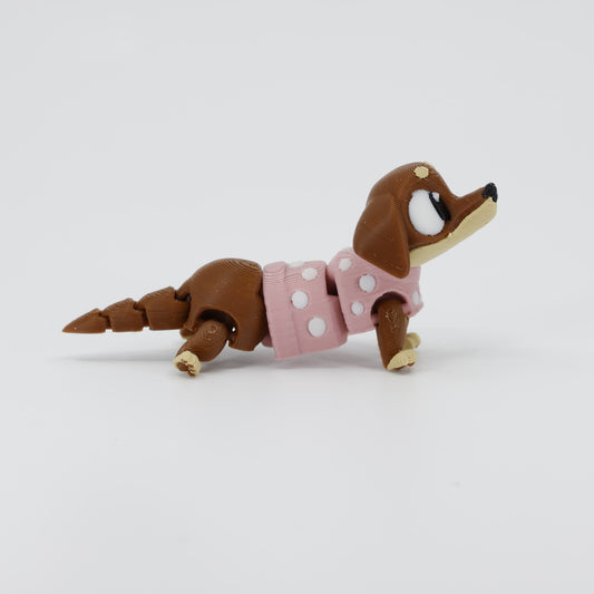 Side profile of the Australian made articulated sausage dog fidget, showing the iconic long body and flexi movement.