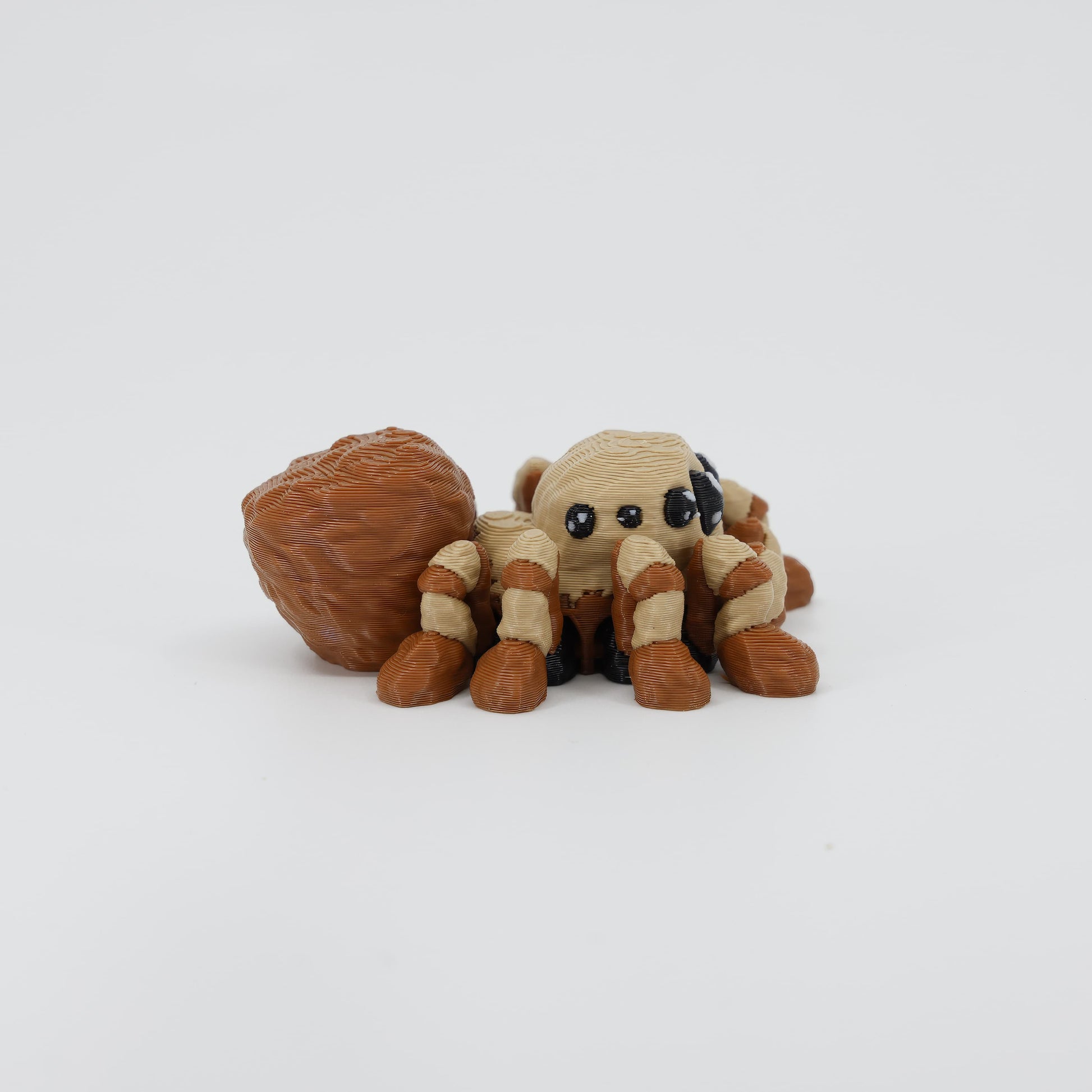 Side profile of the Australian made articulated spider fidget, showing the leg span and flexi body movement.