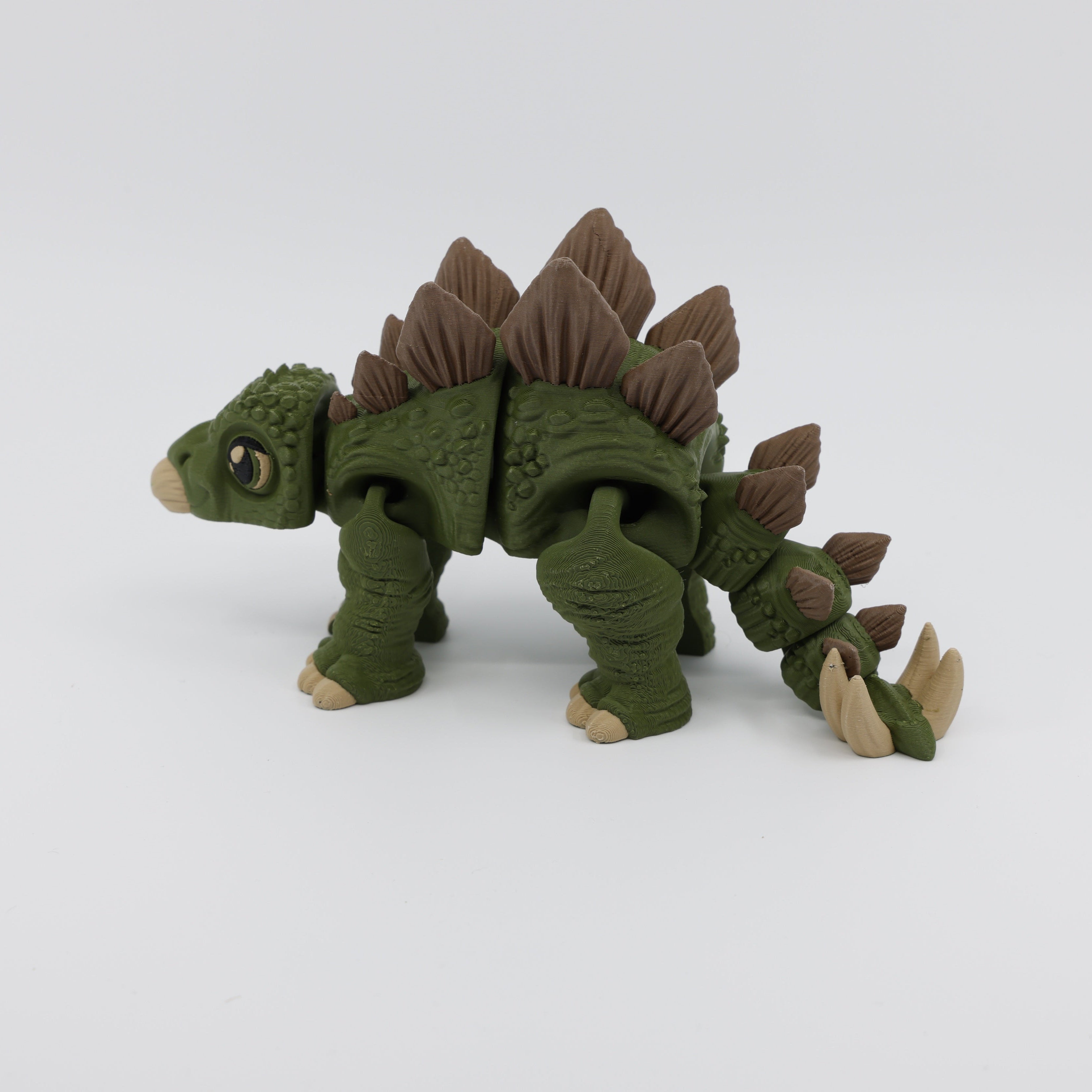 Side view of articulated Stegosaurus fidget – calming sensory fidget
