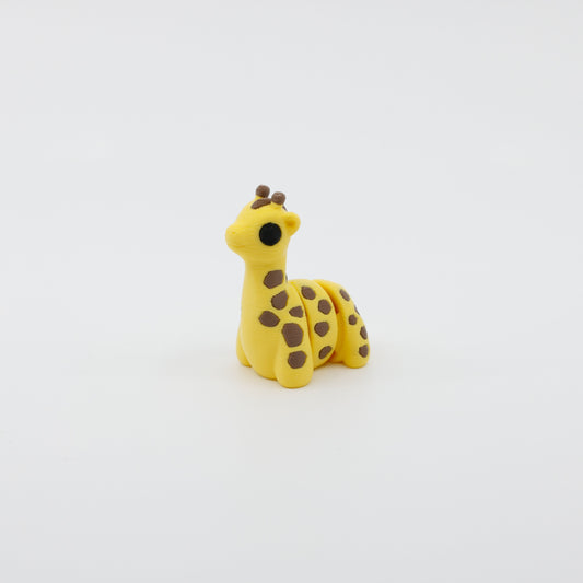 Side profile of articulated giraffe sensory fidget highlighting long neck and body segments