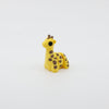 Side profile of articulated giraffe sensory fidget highlighting long neck and body segments