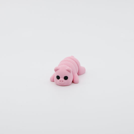 Front view of articulated mini pig sensory fidget with cute facial features and 3D printed details