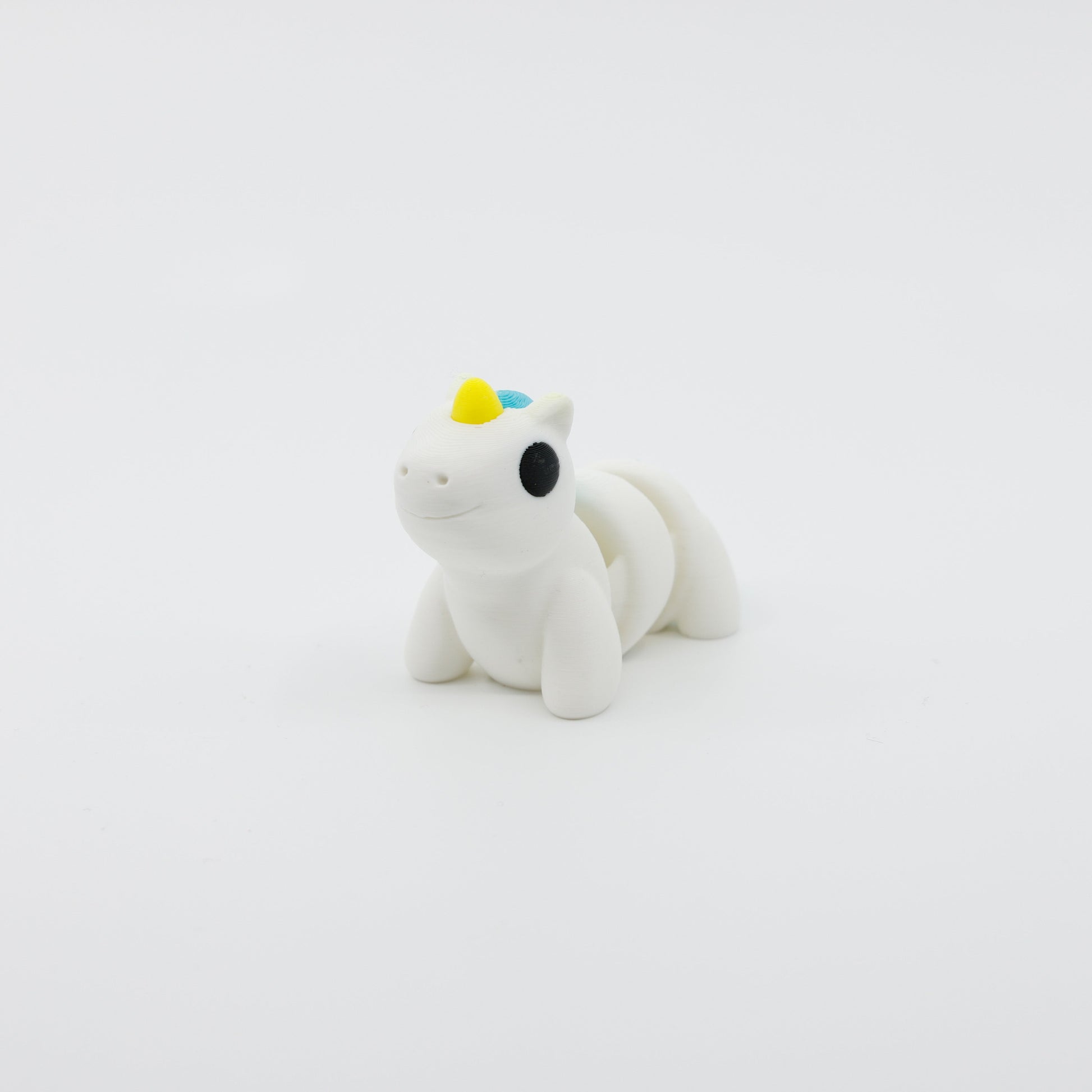 Front view of articulated mini unicorn sensory fidget with colorful mane and 3D printed details