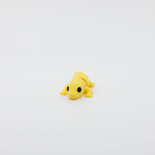 Front view of articulated mini gecko sensory fidget with 3D printed texture and wide-set eyes