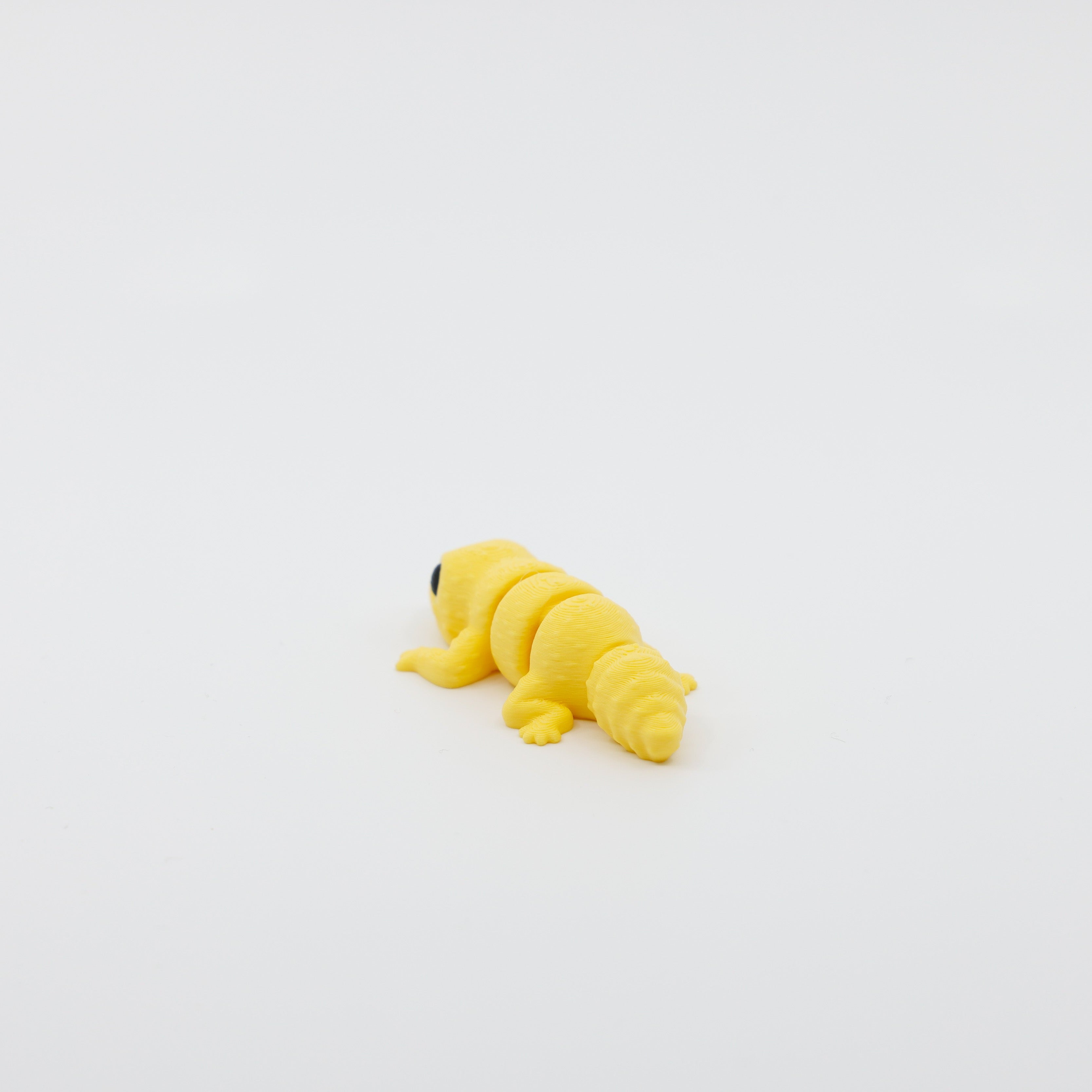 Back view of mini gecko fidget showing detailed tail and segmented articulated body