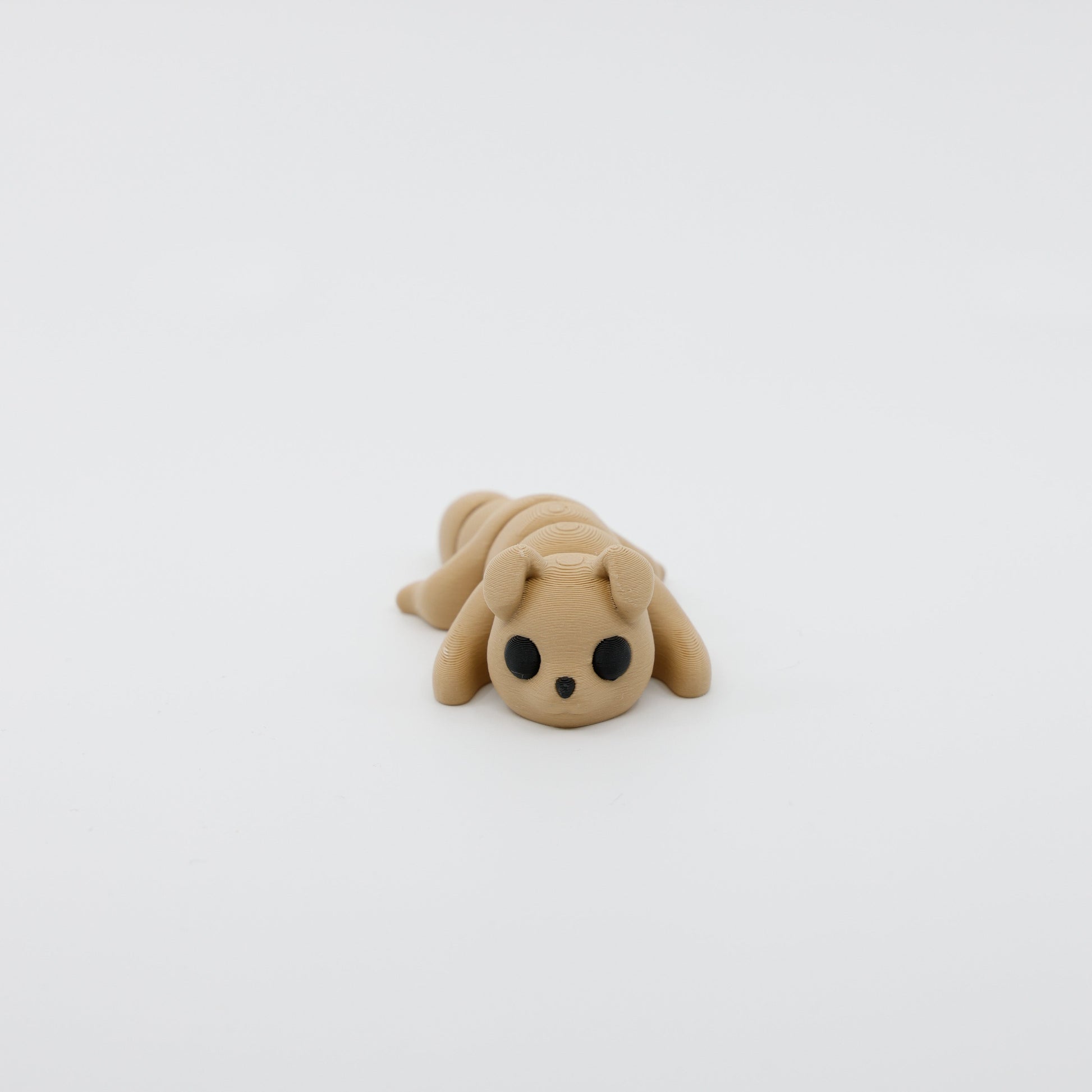 Front view of articulated mini dog sensory fidget with 3D printed ears and cute facial details