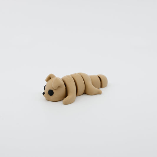 Side profile of articulated dog sensory fidget highlighting body segments and playful pose