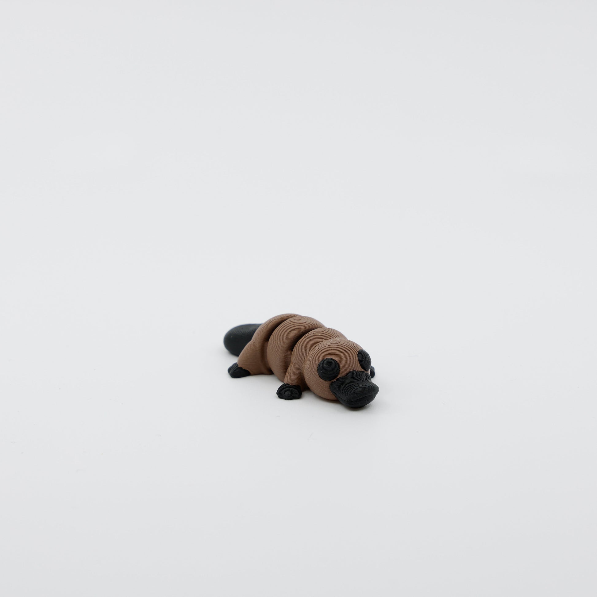 Front view of articulated mini platypus sensory fidget with 3D printed detail