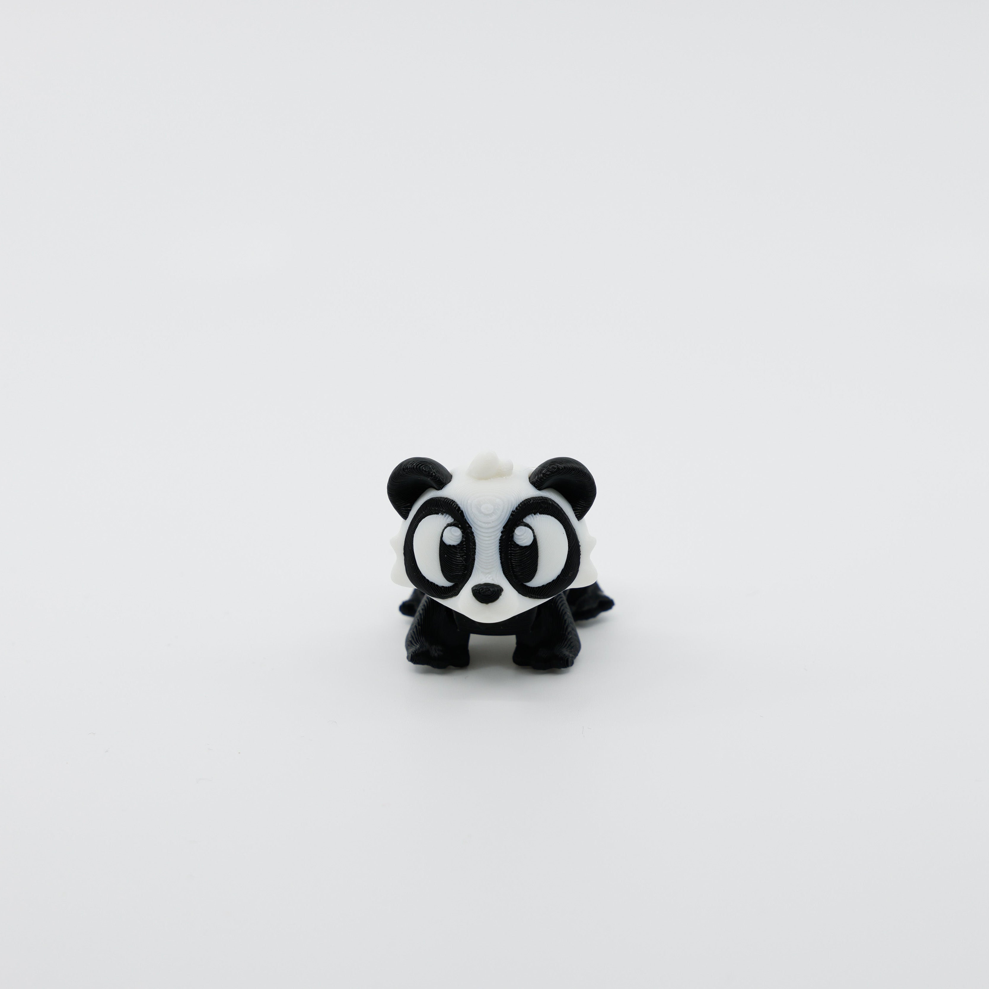 Front view of articulated mini panda sensory fidget with 3D printed detail and expressive face