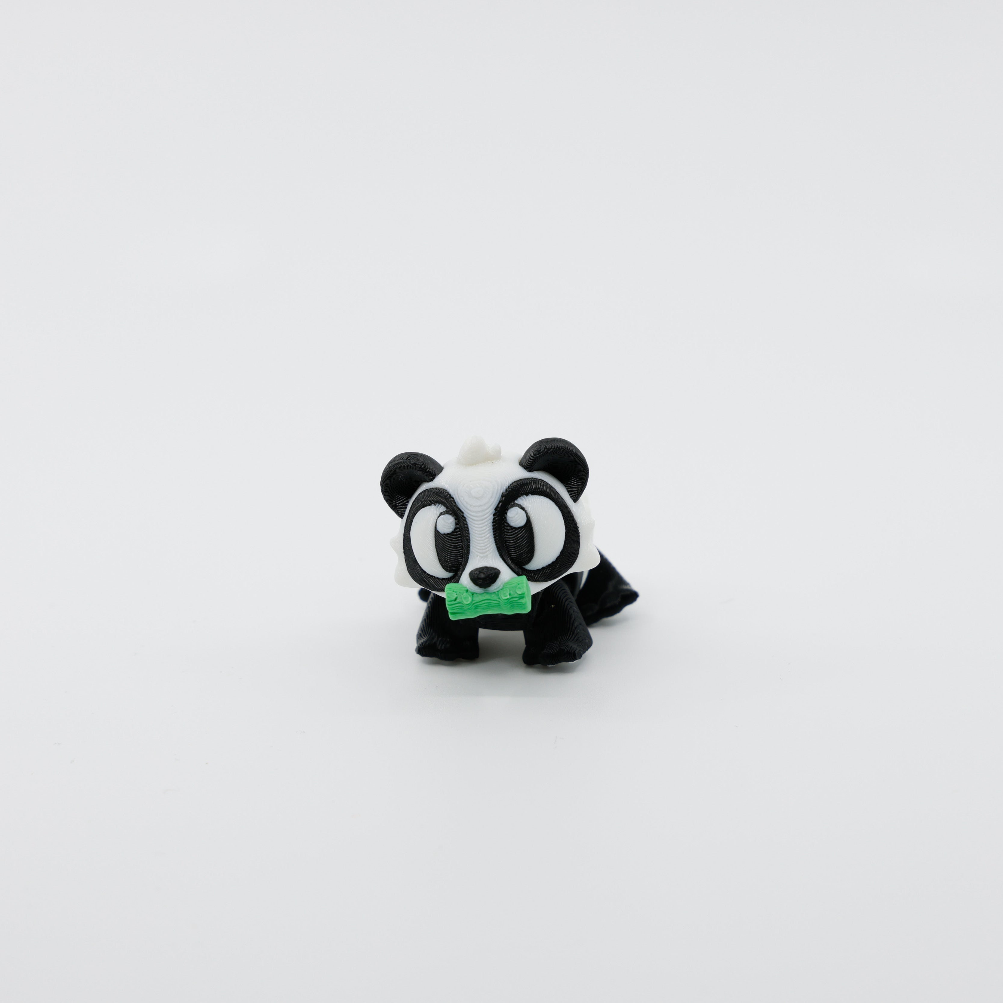 Front view of articulated mini panda sensory fidget holding bamboo with cute 3D printed detail