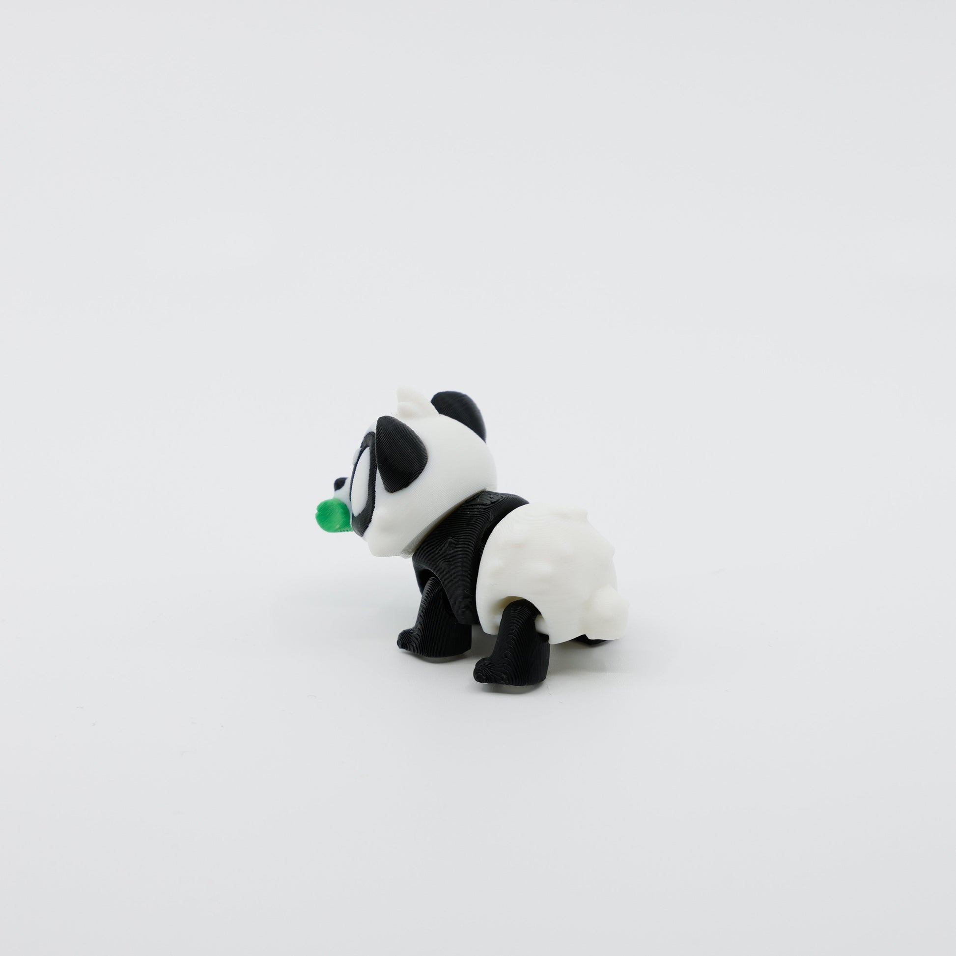 Back view of mini panda fidget showing segmented articulated body and small rounded ears