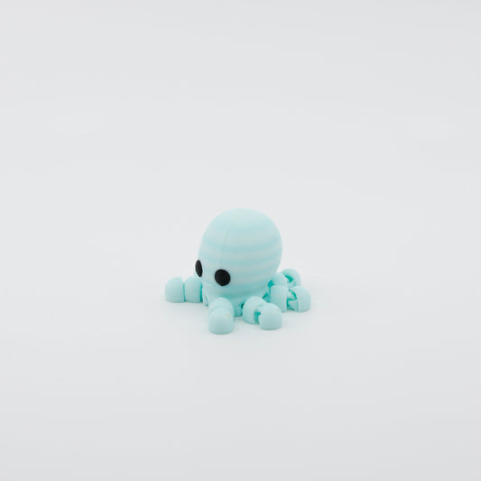 Side profile of articulated octopus sensory fidget highlighting flowing tentacles and body segments