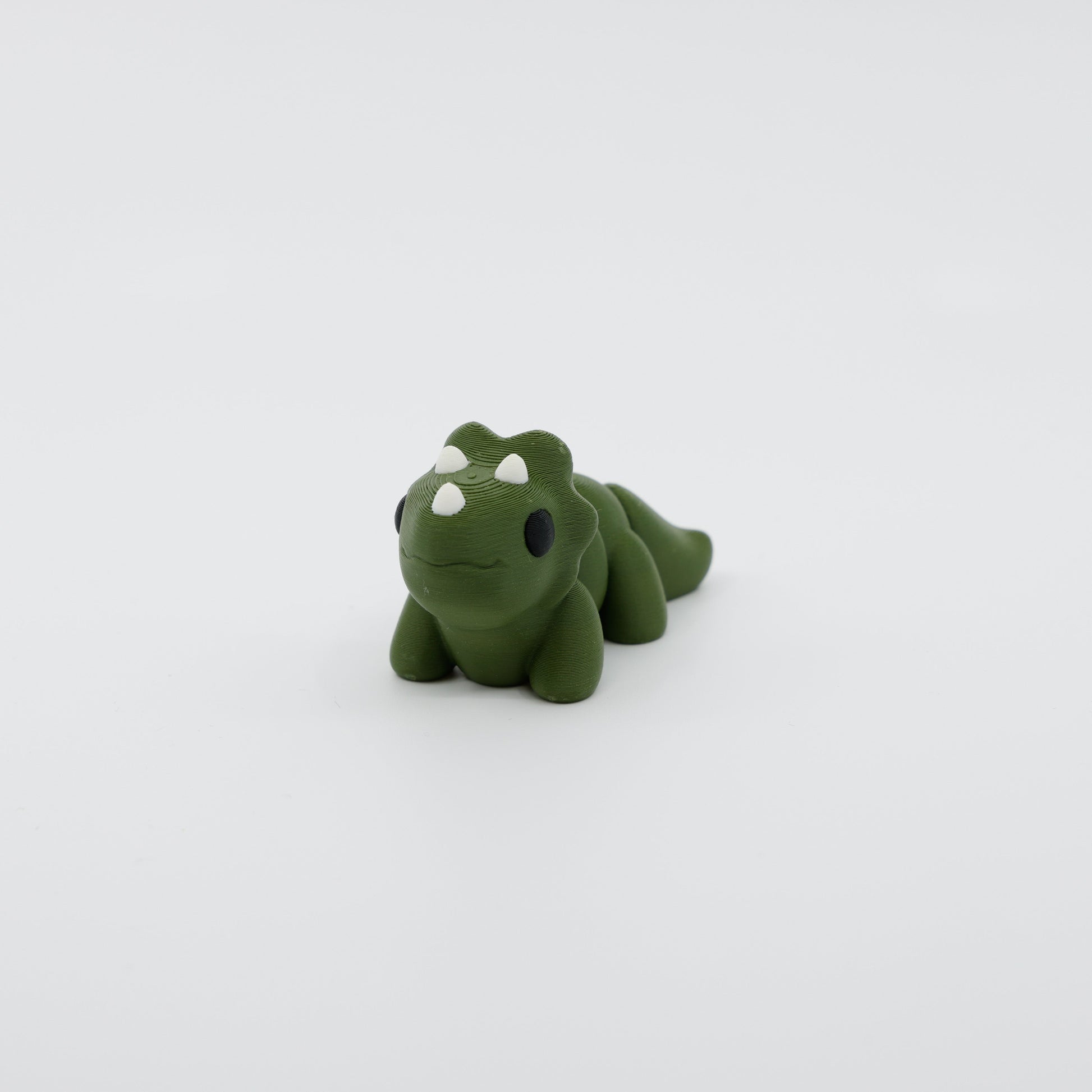 Front view of articulated mini triceratops sensory fidget with detailed horns and 3D printed features