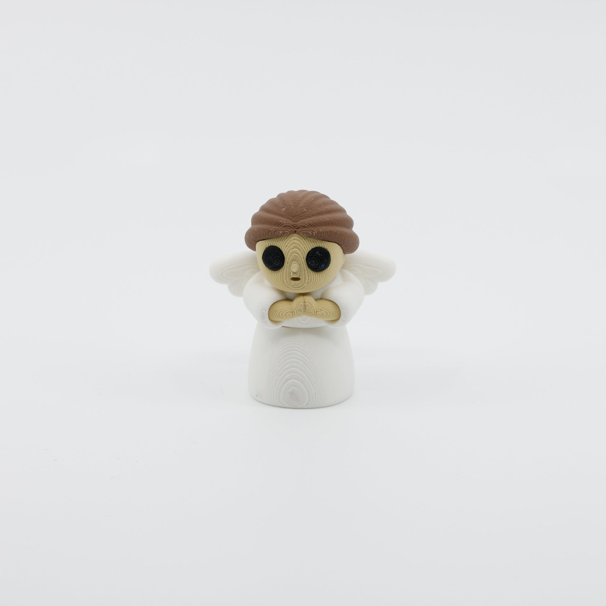 Front view of articulated mini angel sensory fidget with delicate wings and 3D printed facial features