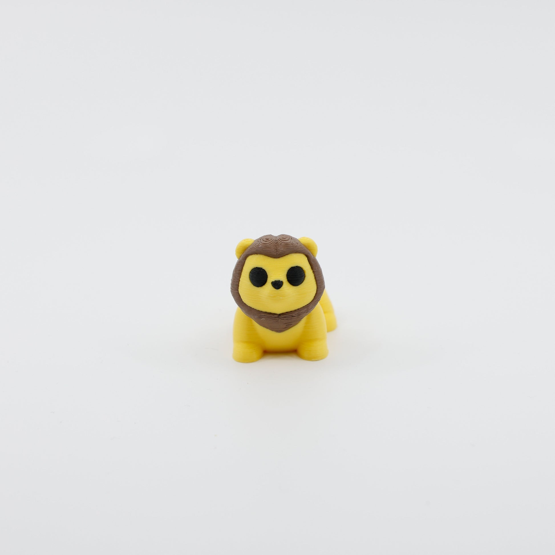 Front view of articulated mini lion sensory fidget with 3D printed mane and cute facial features