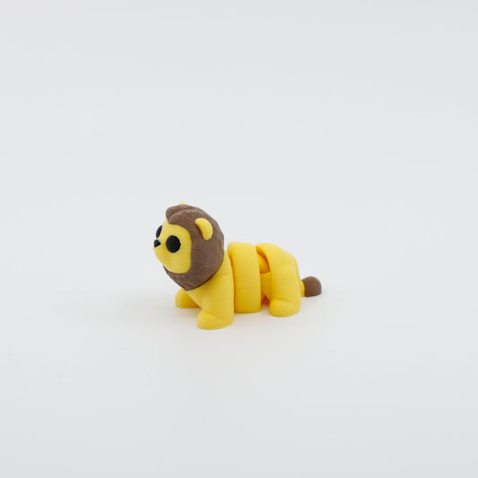 Side profile of articulated lion sensory fidget highlighting segmented body and flowing mane