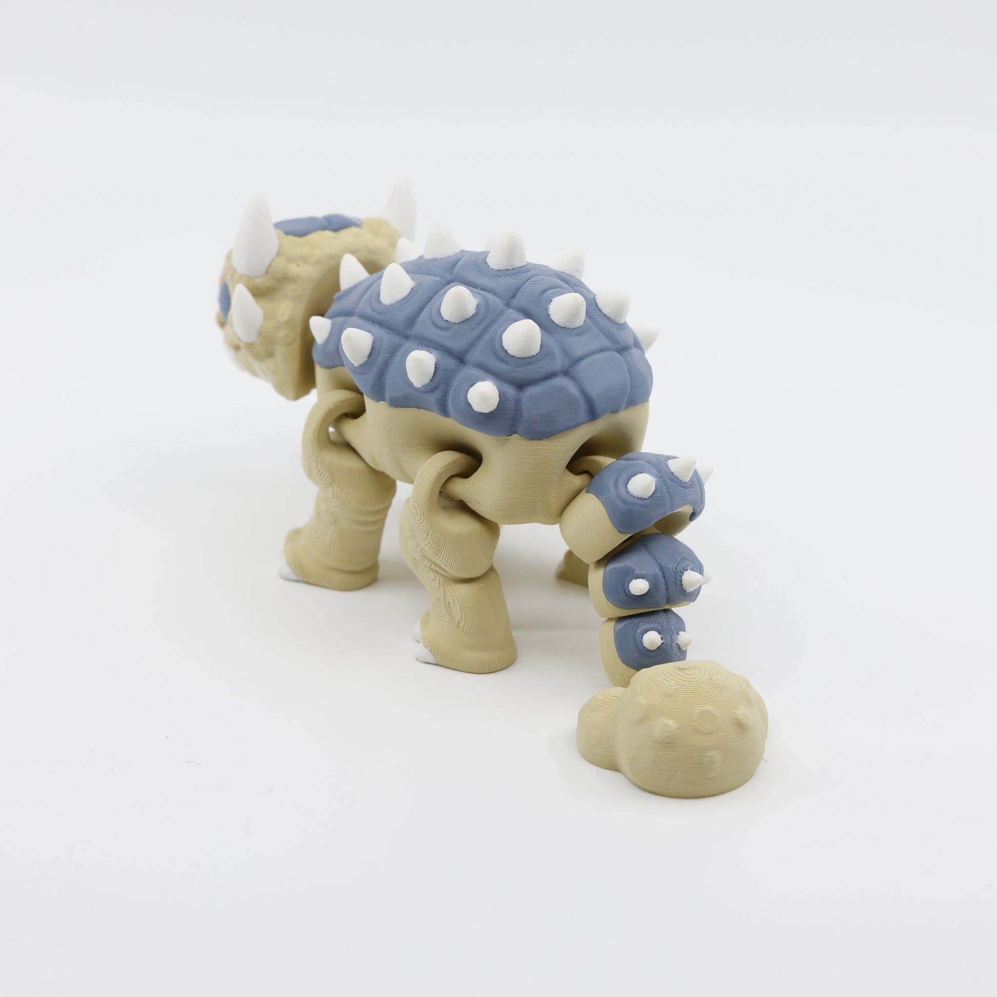 Back view of Ankylosaurus fidget showing tail and detail – articulated sensory toy