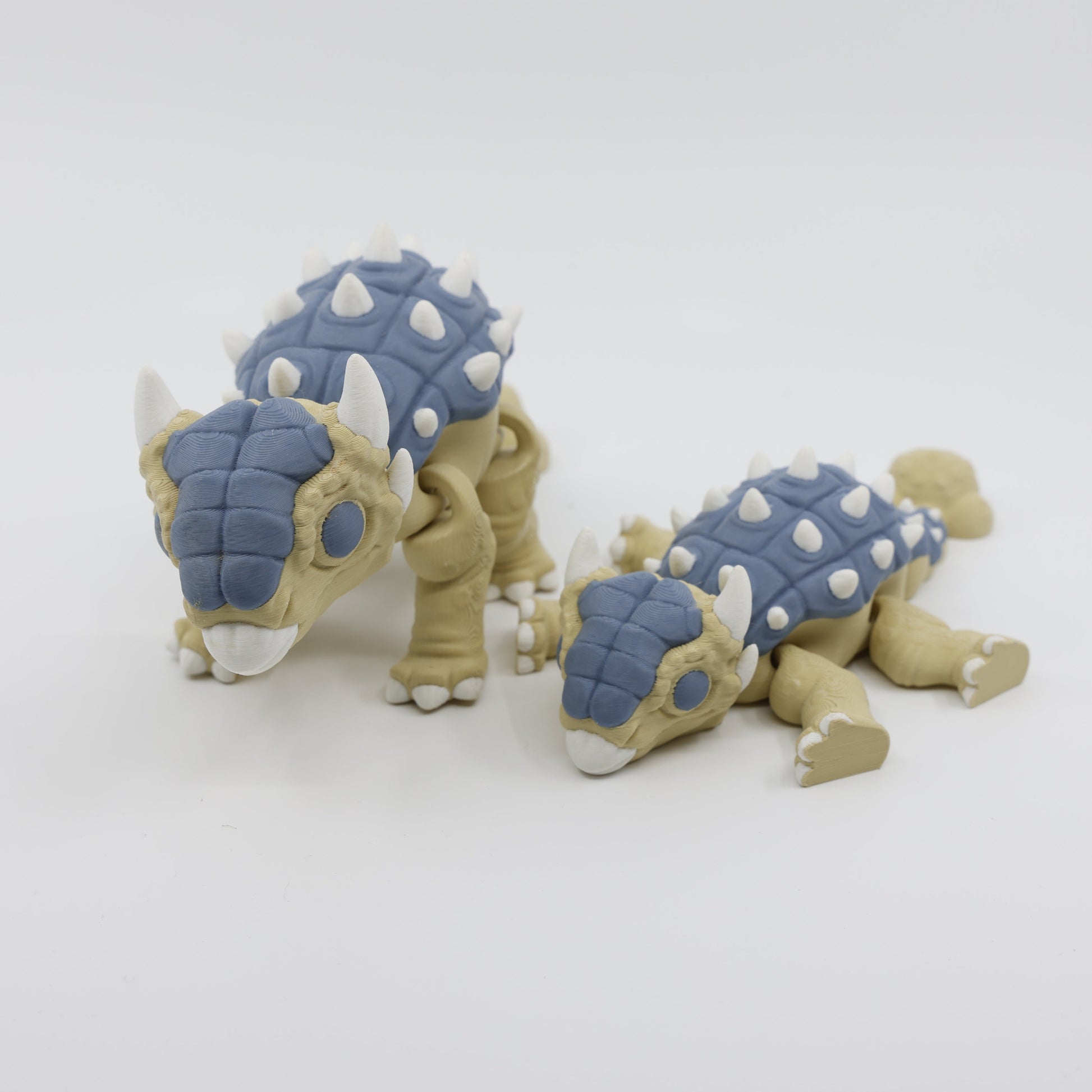 Two articulated Ankylosaurus fidgets side by side – calming sensory dinosaur fidgets