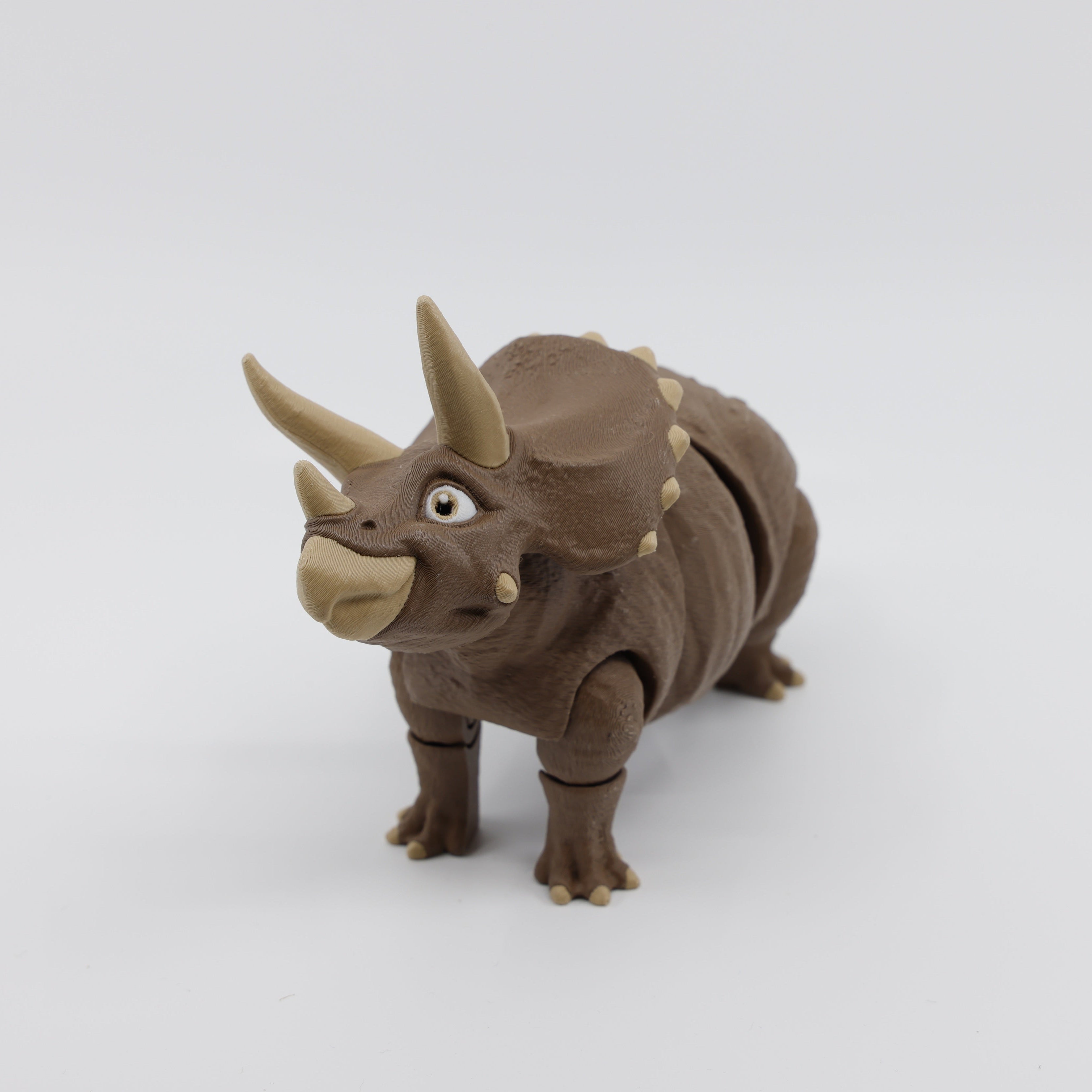 Front view of brown Triceratops fidget – articulated sensory dinosaur