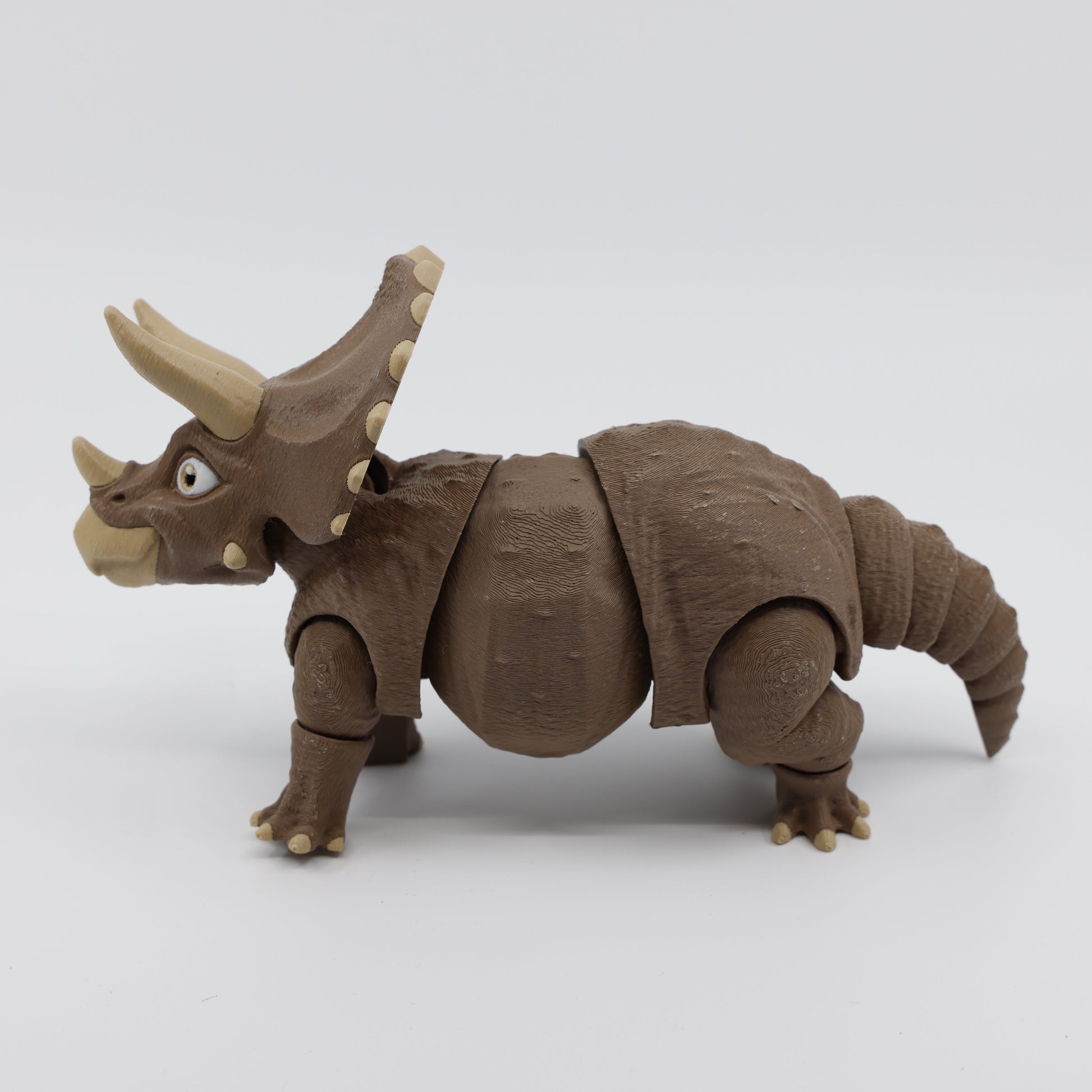 Brown Triceratops fidget facing left – 3D printed articulated sensory fidget