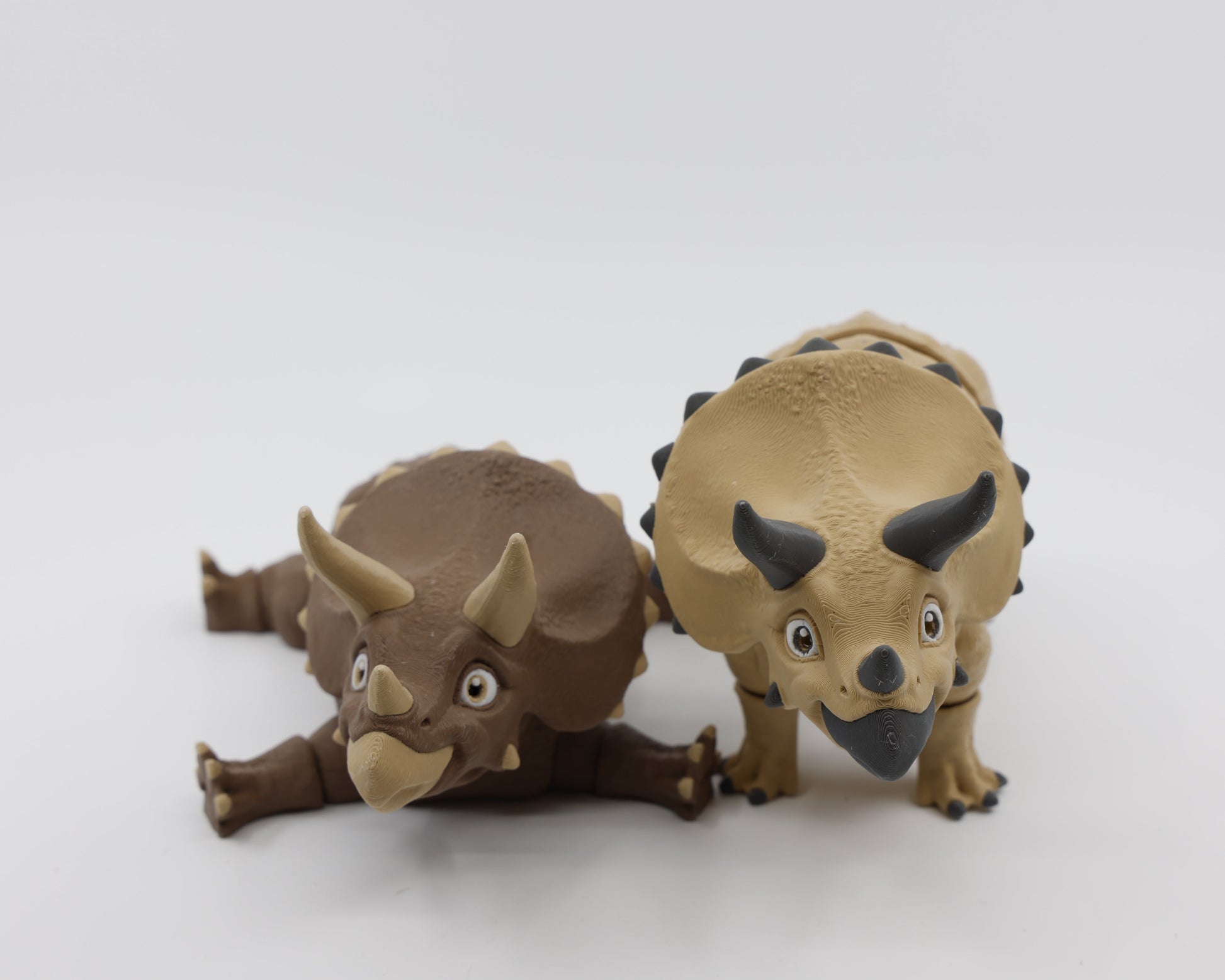 Brown and light brown Triceratops fidgets side by side – dinosaur sensory fidgets