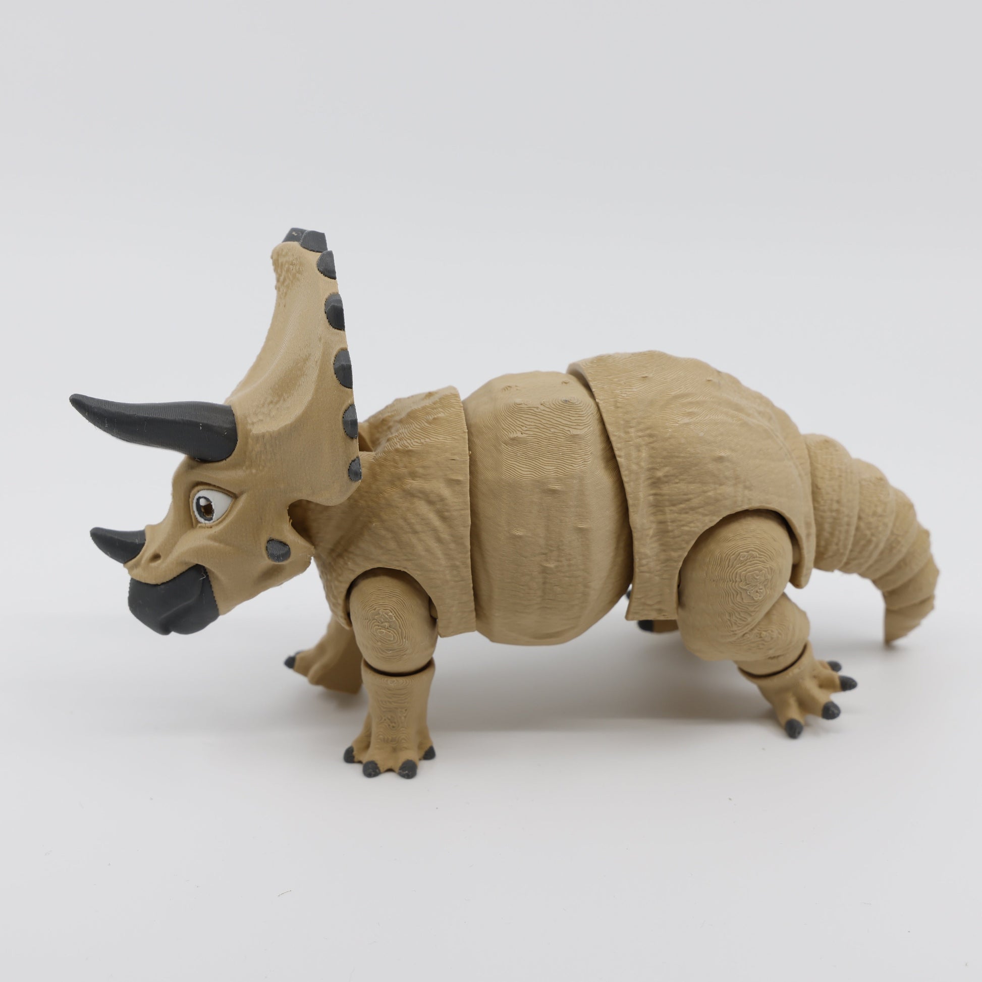 Light brown Triceratops fidget facing left – articulated sensory fidget toy