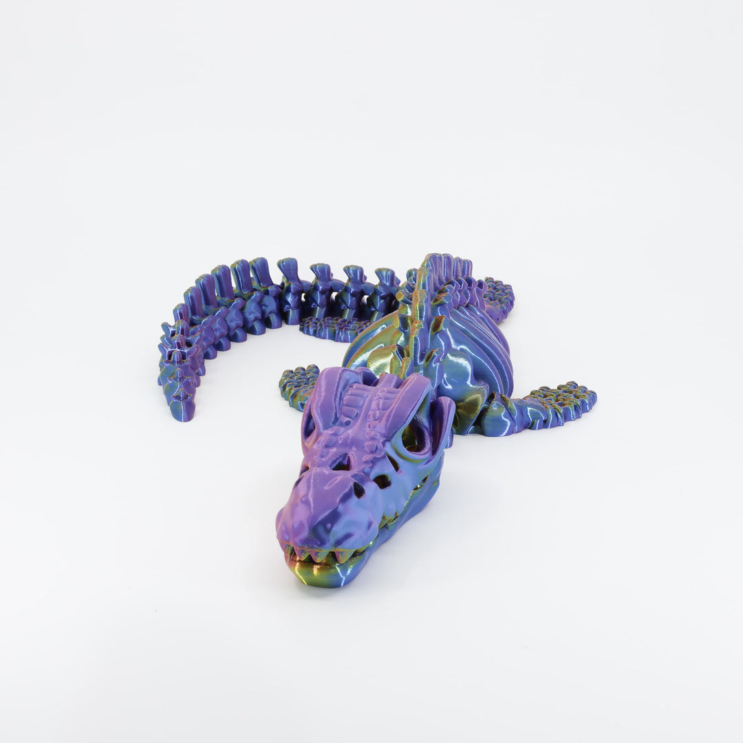 Flexi 3D printed dinosaur skeleton Mosasaurus shown from the front. Highlights the closed jaw with teeth and articulated front flippers.