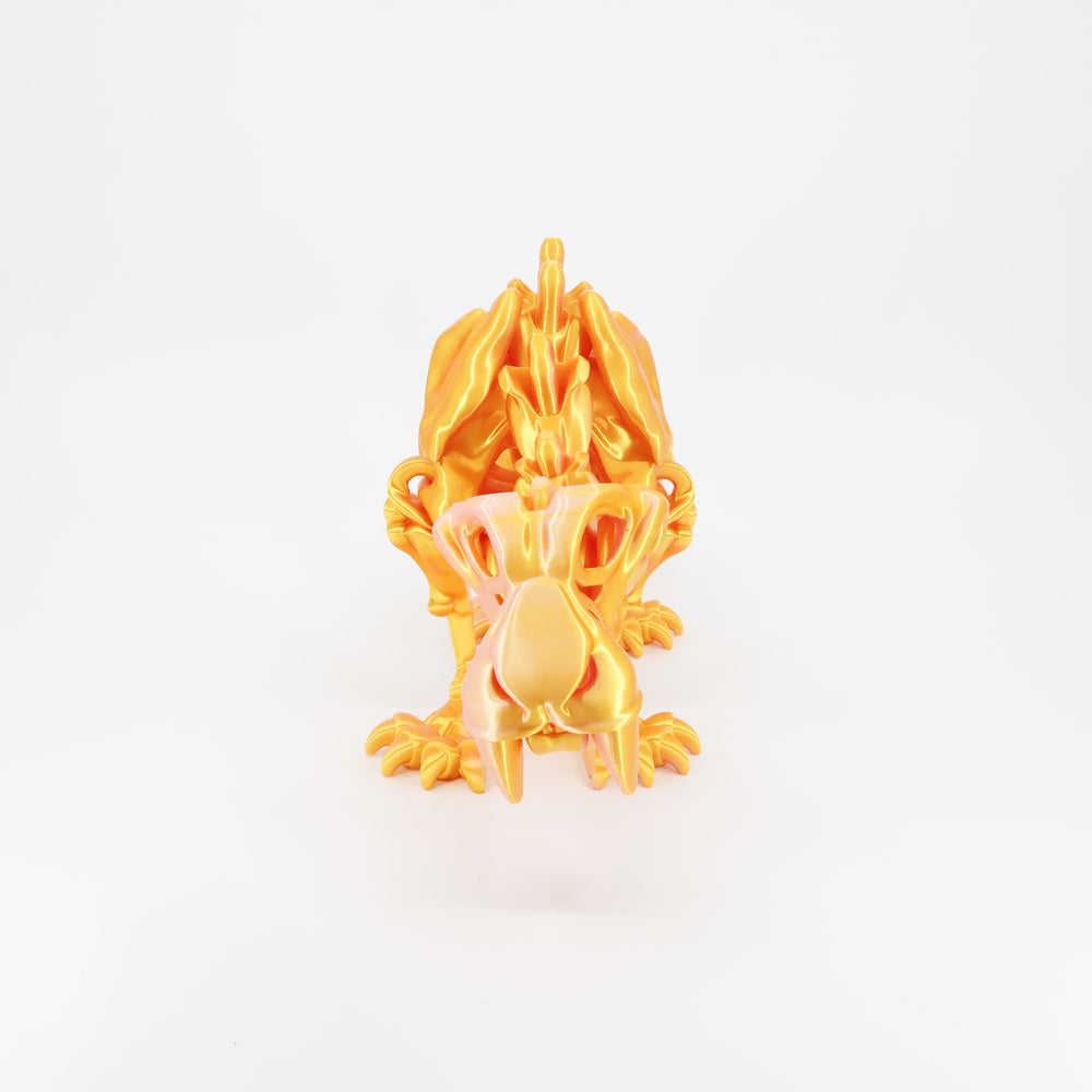 Flexi 3D printed skeleton sabertooth tiger toy shown from the front. Highlights the iconic long fangs and articulated jaw.