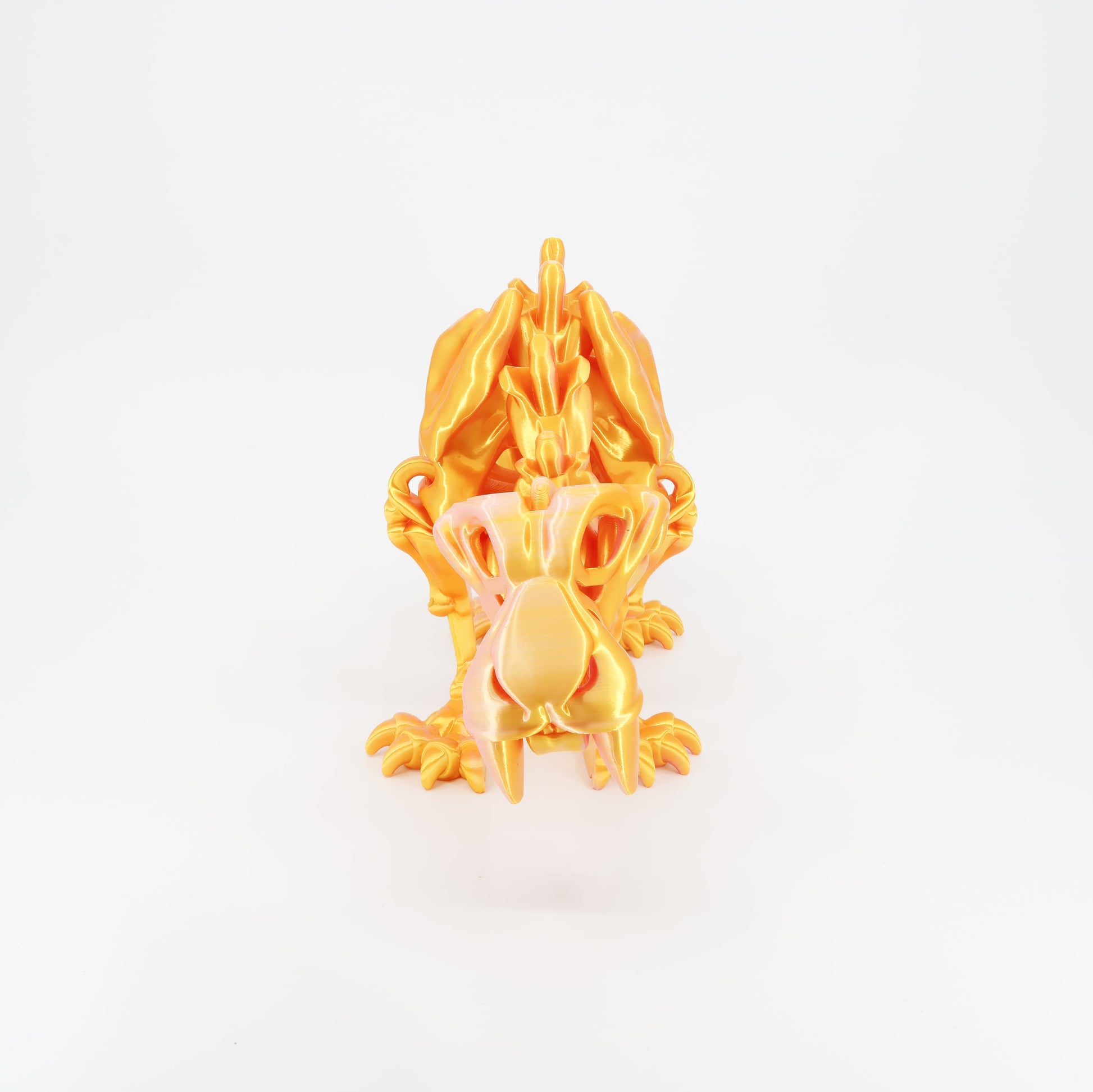 Flexi 3D printed skeleton sabertooth tiger toy shown from the front. Highlights the iconic long fangs and articulated jaw.