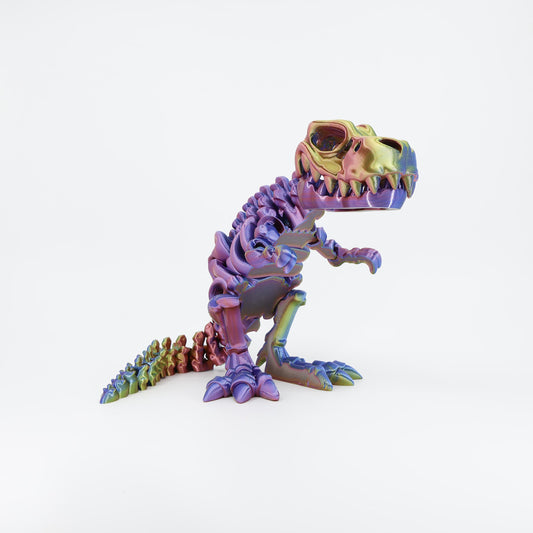 3D printed dinosaur skeleton T-Rex fidget toy shown from the front. Highlights the articulated jaw and rib cage structure.